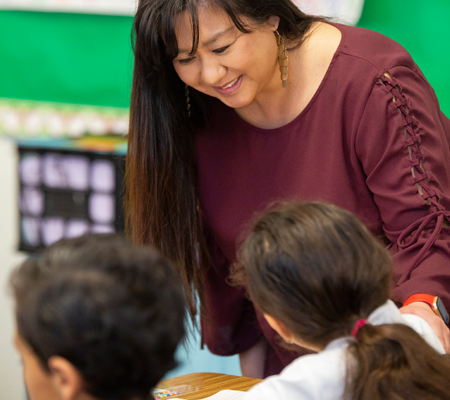 Photo: Teacher talking to student